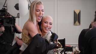 Khloé and Kim happily hugging in Met Gala outfits in The Kardashians