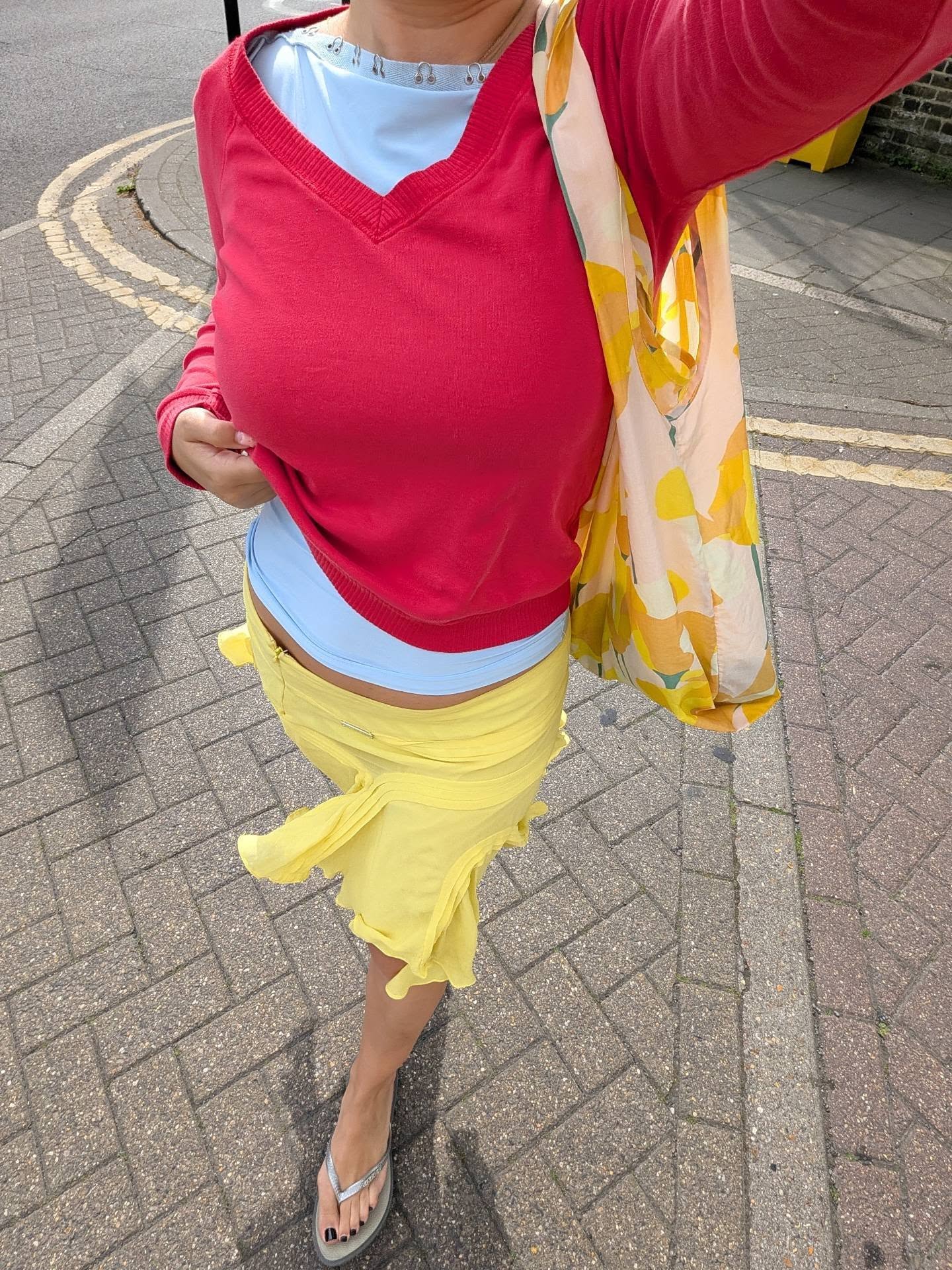 An image of a woman wearing summer knee length skirt outfit 2026