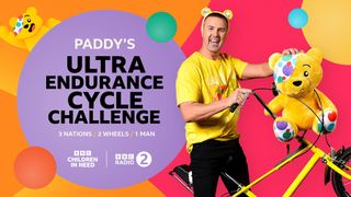 Paddy McGuinness poses with a yellow Chopper, Pudsey Bear and wearing Pudsey Bear ears for Children in Need 2024.