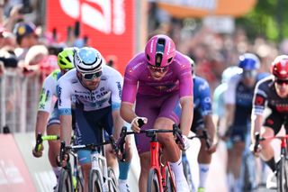 LUCCA, ITALY - MAY 08: (L-R) Phil Bauhaus of Germany and Team Bahrain - Victorious, Jonathan Milan of Italy and Team Lidl - Trek - Purple Points Jersey and Caleb Ewan of Australia and Team Jayco AlUla sprint at finish line during the 107th Giro d'Italia 2024, Stage 5 a 178km stage from Genova to Lucca / #UCIWT / on May 08, 2024 in Lucca, Italy. (Photo by Tim de Waele/Getty Images)