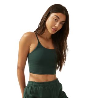Best Pilates clothes: A woman wearing tank bra in green