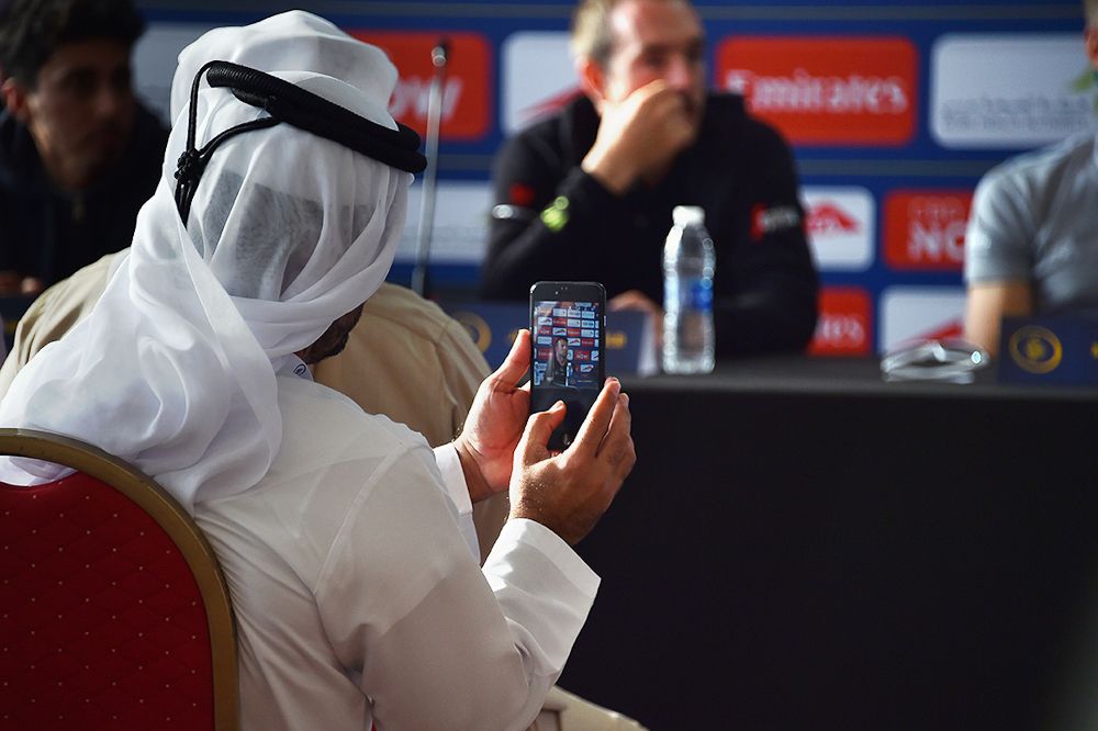 An audience memberr captures a photo at the Dubai Tour press conference
