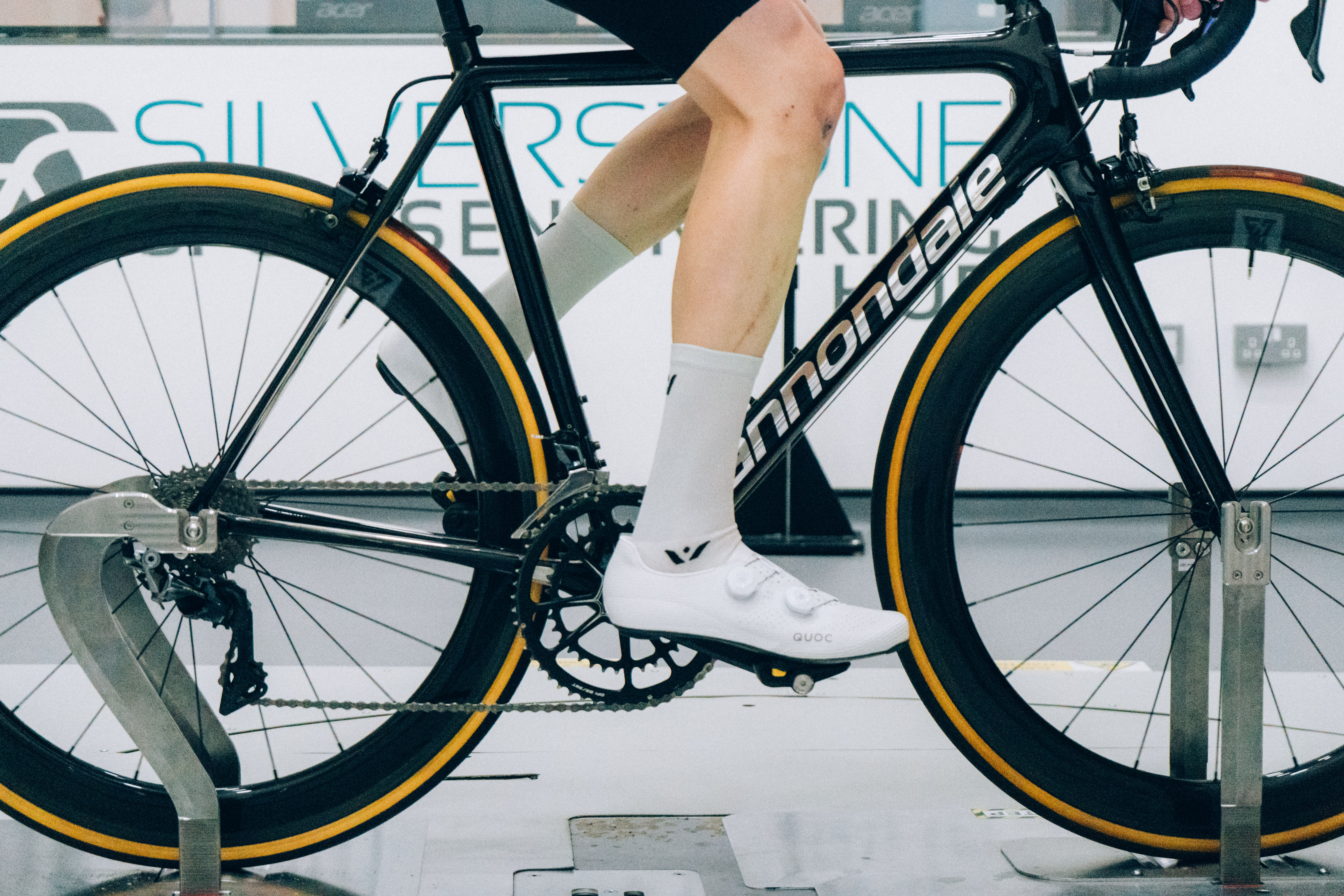 A close up of the socks that Tom is wearing while riding a bike in the wind tunnel