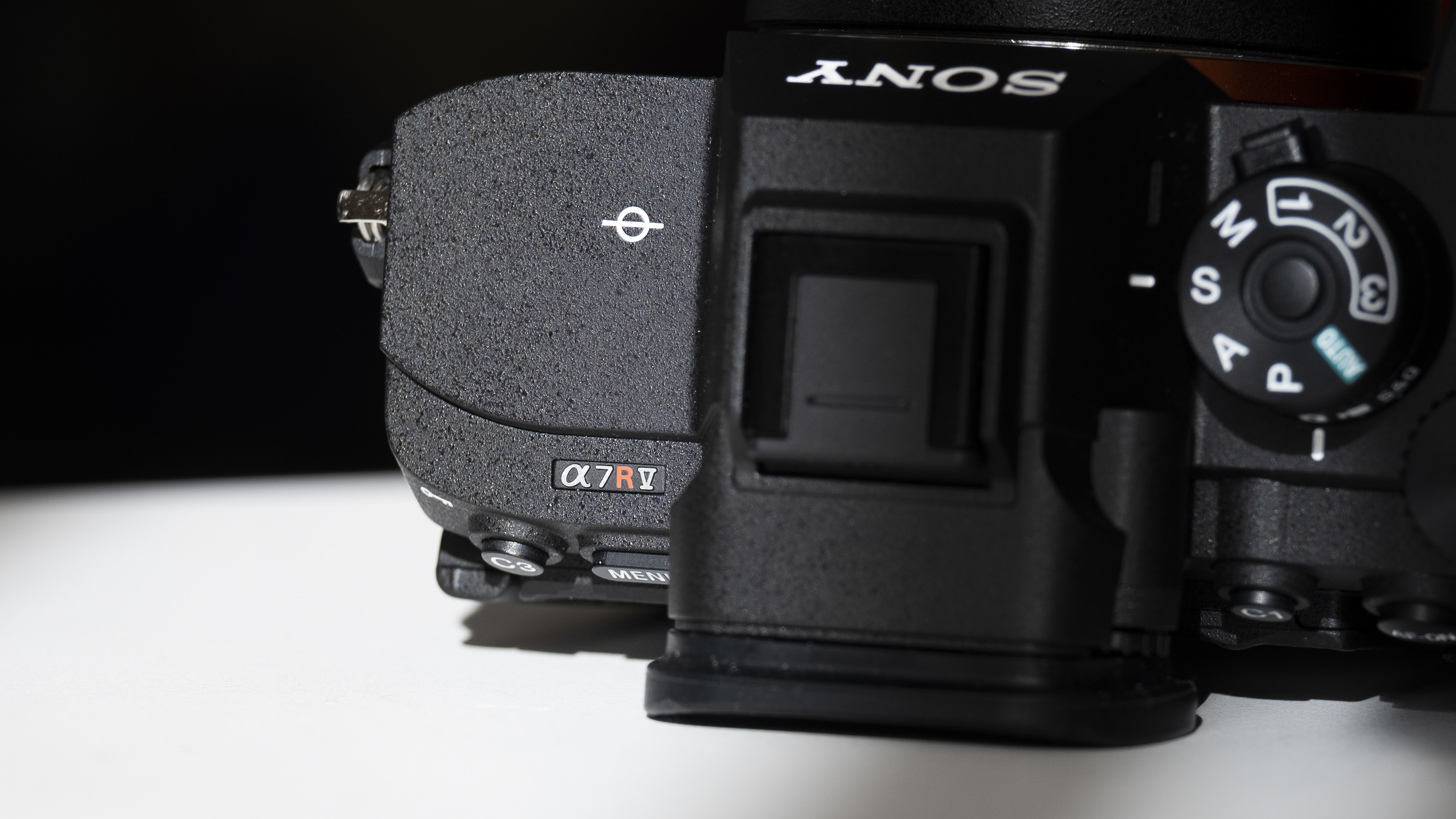 The Sony A7R V camera sitting on a white table