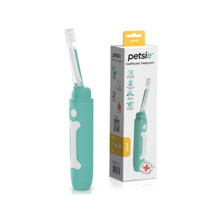 Petsie Dog Toothbrush next to the packaging, one of the best toothbrushes for dogs