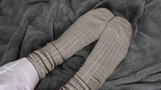 A pair of socks on the Slumberdown Elegantly Warm Heated Blanket