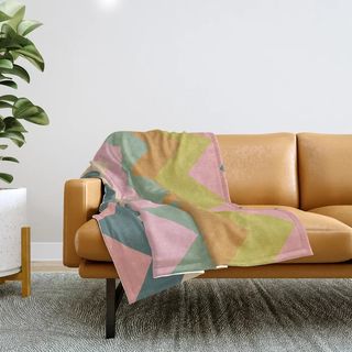 A colorful throw on a sofa