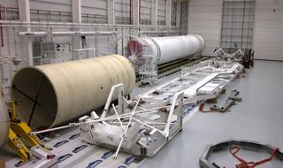 The first stage of Orbital Sciences' first Taurus 2 rocket is shown in the new Horizontal Integration Facility at NASA's Wallops Flight Facility in Wallops Island, Va.