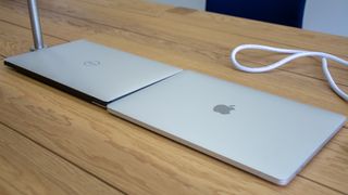 The Dell XPS 13 and Apple MacBook Pro 13in (2018) side-by-side with the lids closed