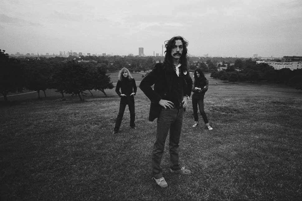 Rush pose for a group portrait on Parliament Hill, on Hampstead Heath, London, England, Great Britain, circa 1978