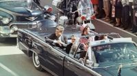 US President John F Kennedy, First Lady Jacqueline Kennedy, Texas Governor John Connally, and others smile at the crowds lining their motorcade route in Dallas, Texas, on November 22, 1963. Minutes later the President was assassinated as his car passed through Dealey Plaza.
