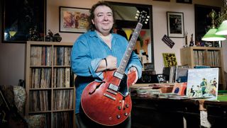 Bernie Marsden holds a Gibson guitar at his home in Buckinghamshire, England on May 22, 2014