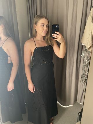 Woman wears black cutout dress