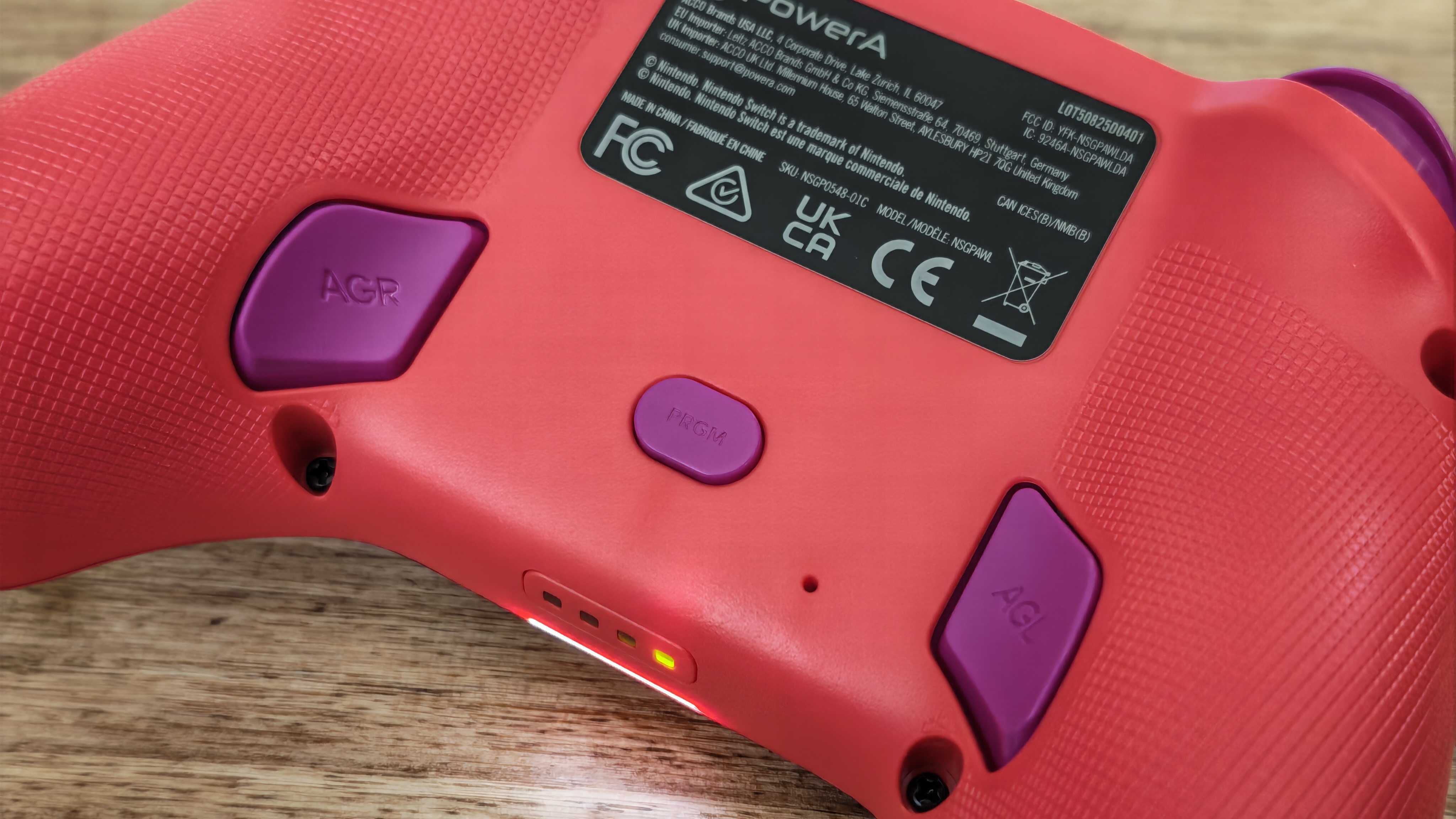 The PowerA Advantage Wireless Controller for Nintendo Switch 2 on a wooden table surface.