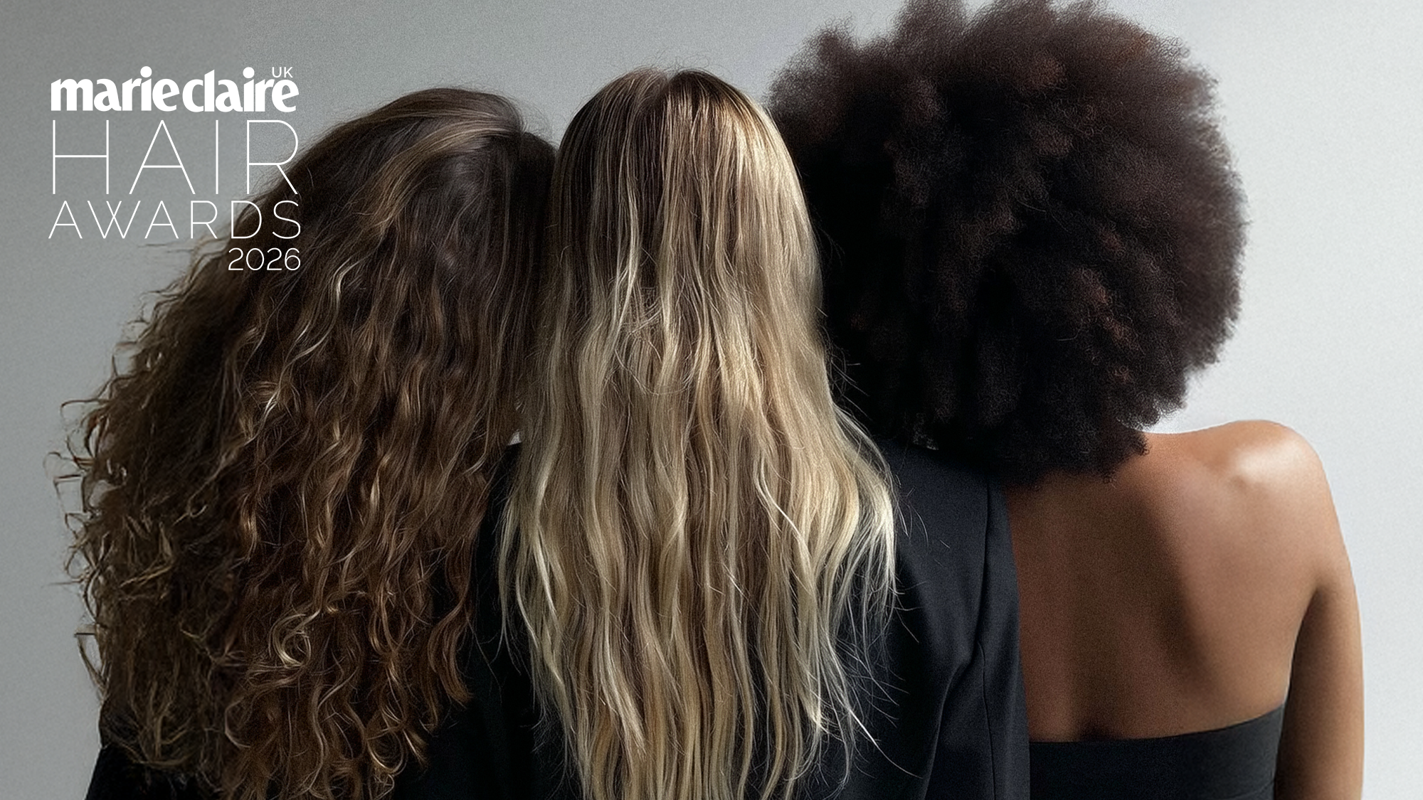 three women looking away from the camera, showing off their different hair textures