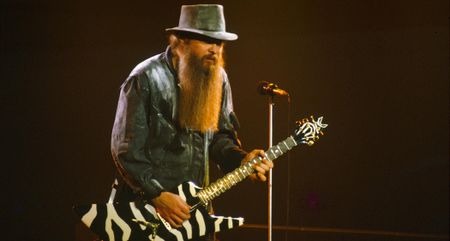 Billy Gibbons of ZZ Top plays a zebra-striped custom electric live at Wembley in the mid '80s.