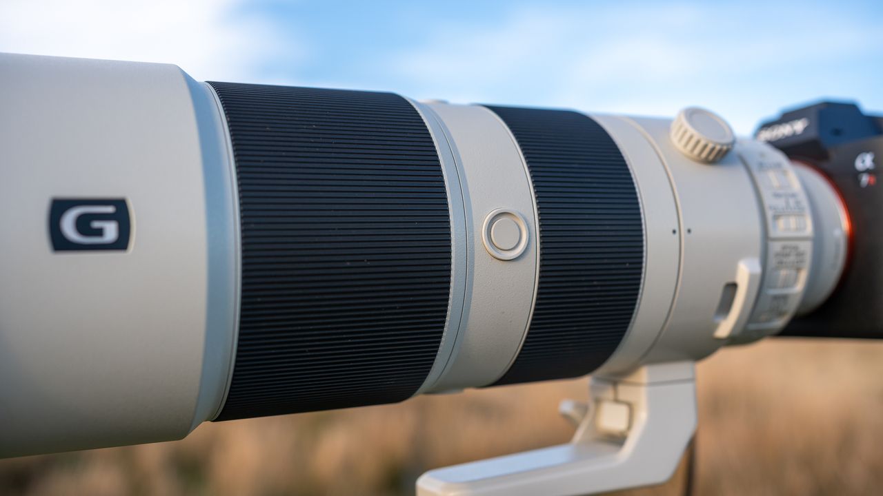 Sony FE 200-600 f/5.6-6.3 G OSS on a tripod in a field