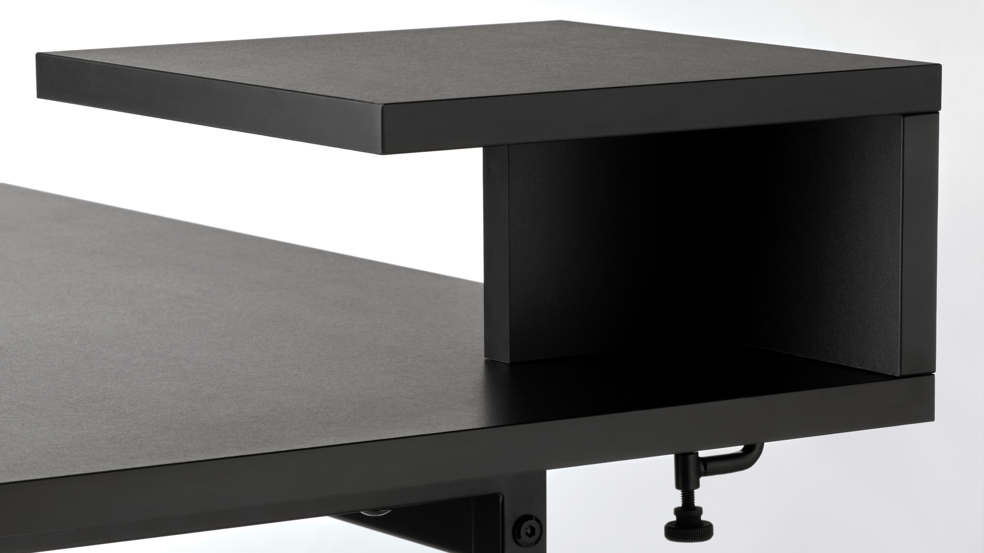 Detail of the Ikea Obegransad table in black on a white background