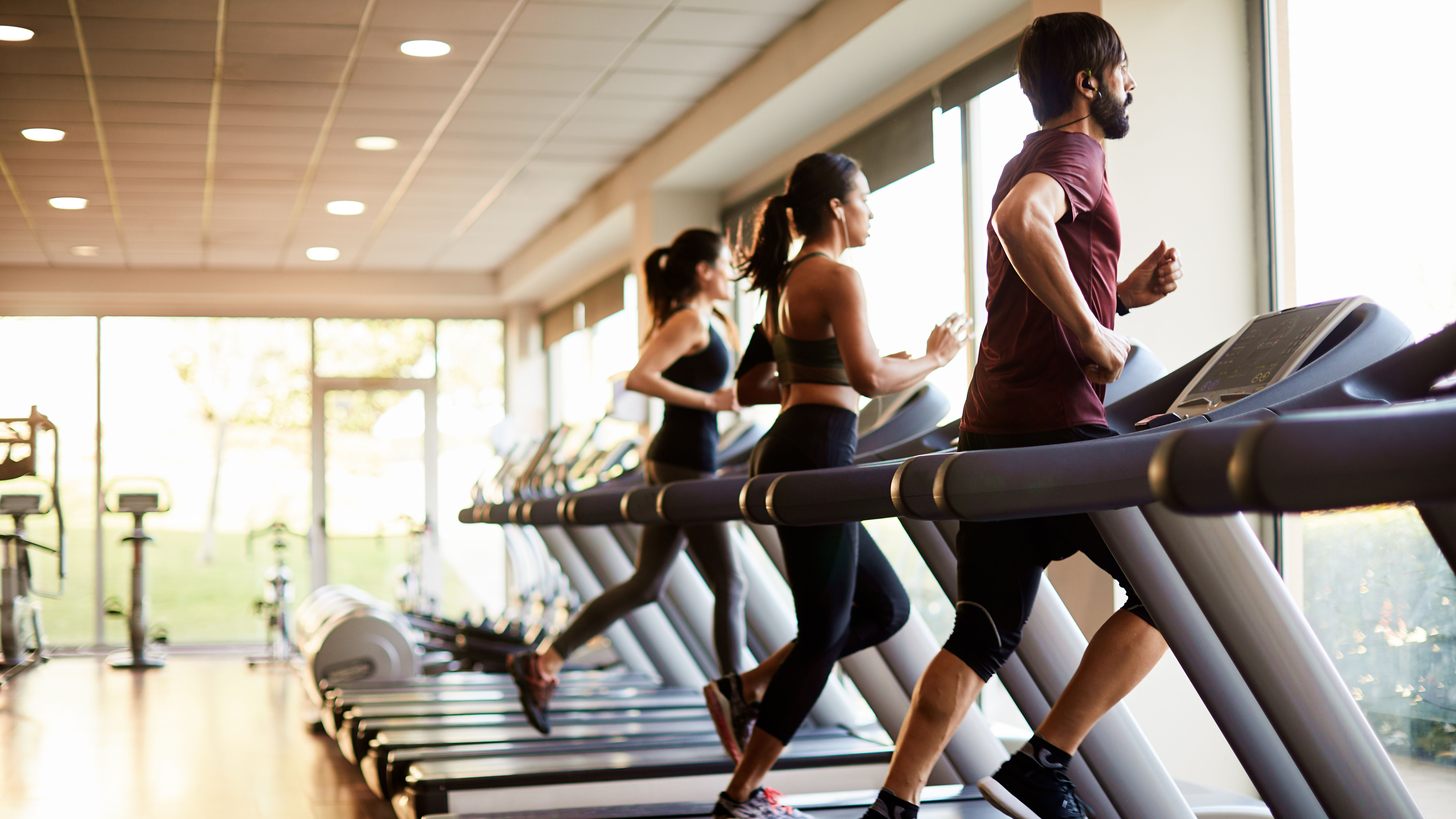 People running on treadmills in the gym