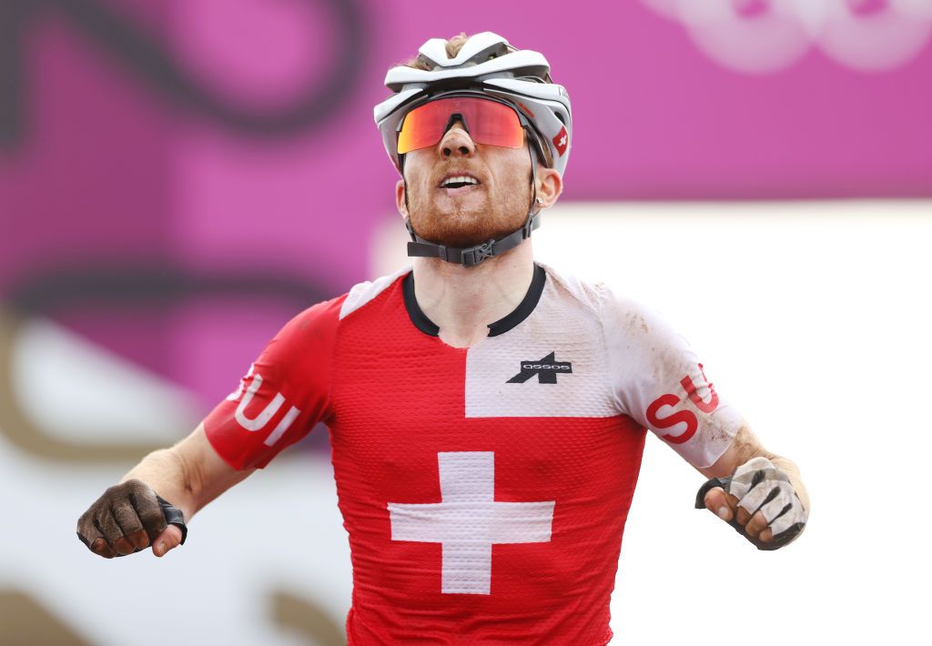 IZU JAPAN JULY 26 Mathias Flueckiger of Team Switzerland crosses the finish line celebrating his second place during the Mens Crosscountry race on day three of the Tokyo 2020 Olympic Games at Izu Mountain Bike Course on July 26 2021 in Izu Shizuoka Japan Photo by Michael SteeleGetty Images