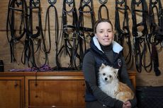 Sophie Wells relaxing between rides in the tack room