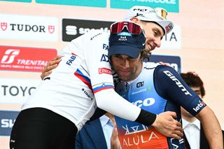 Second placed Team Jayco Alulas Australian rider Michael Matthews R celebrates with UAE Team Emirates Slovenian rider Tadej Pogacar L on the podium after the 115th MilanSanRemo oneday classic cycling race between Milan and SanRemo northern Italy on March 16 2024 Photo by Marco BERTORELLO AFP Photo by MARCO BERTORELLOAFP via Getty Images