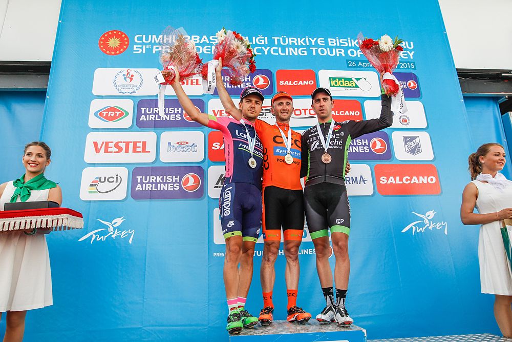 Kristijan Durasek, Davide Rebellin and Eduardo Sepulveda on the stage podium