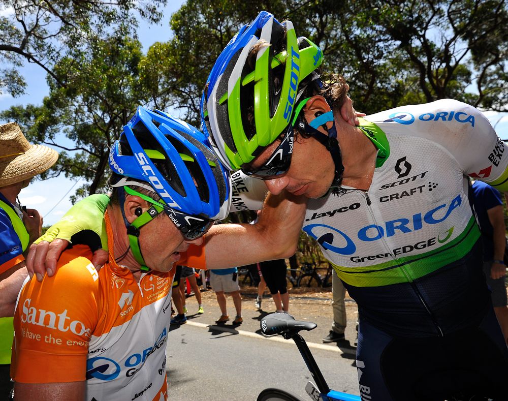 Simon Gerrans (L) speaks with Orica Greenedge teammate Daryl Impey after stage five of the Tour Down Under