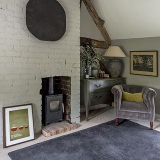 room with white wall and grey sofa