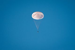 The Soyuz TMA-20 spacecraft is seen as it lands with Expedition 27 Commander Dmitry Kondratyev and Flight Engineers Paolo Nespoli and Cady Coleman in a remote area southeast of the town of Zhezkazgan, Kazakhstan, on Tuesday, May 24, 2011.