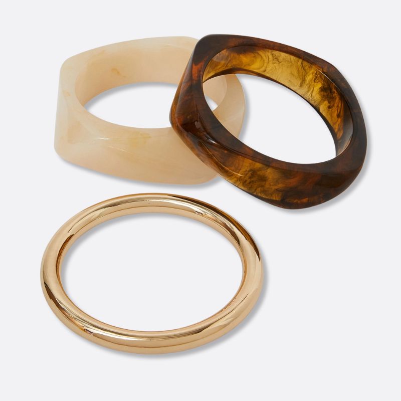 A cutout of three Accessorize bangles