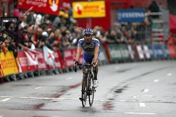 Matteo Tosatto (Quick Step) crosses the finish, one of the six riders who managed to avoid the crash at 2.5km to go.