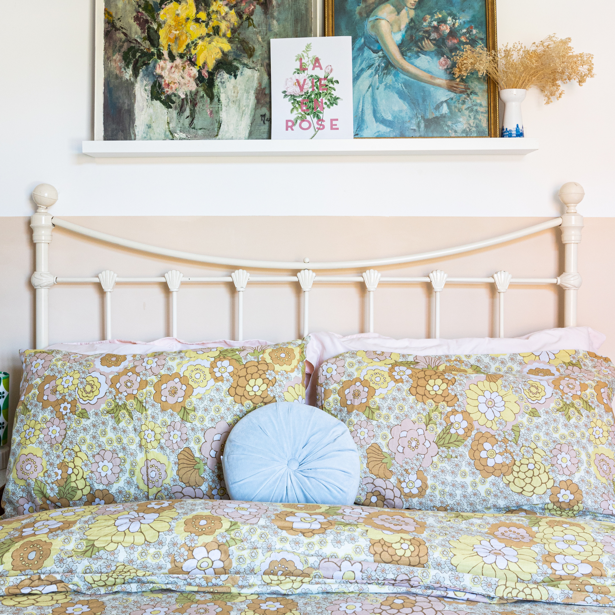 Double bed with vintage floral bedding.