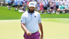 Jon Rahm walks off the green