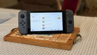 Nintendo Switch console on table with wine corks