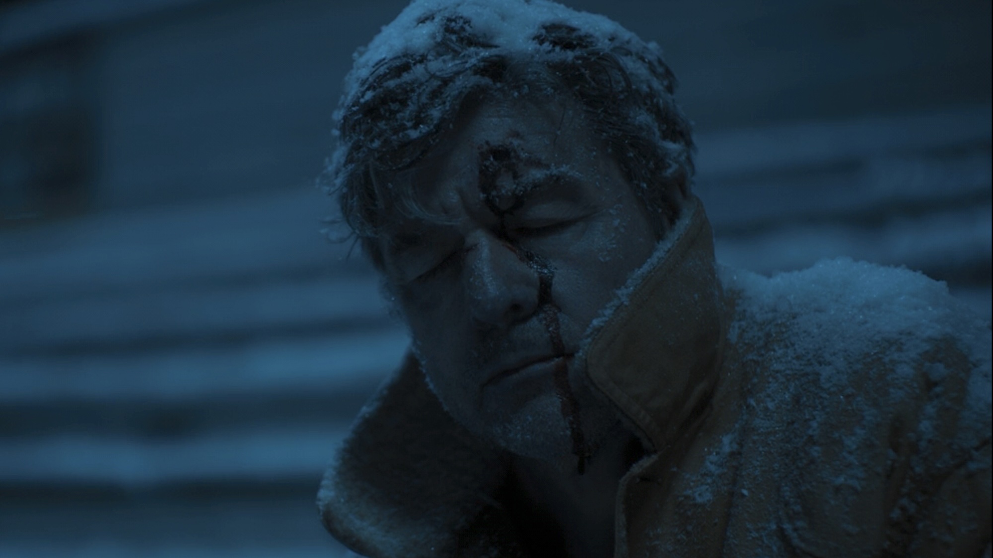 Hal Jordan's iced-up corpse with a bullet hole in his forehead sitting on football bleachers in Lanterns Season 1 premiere