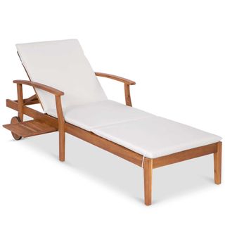 an outdoor chaise lounge with a cushion