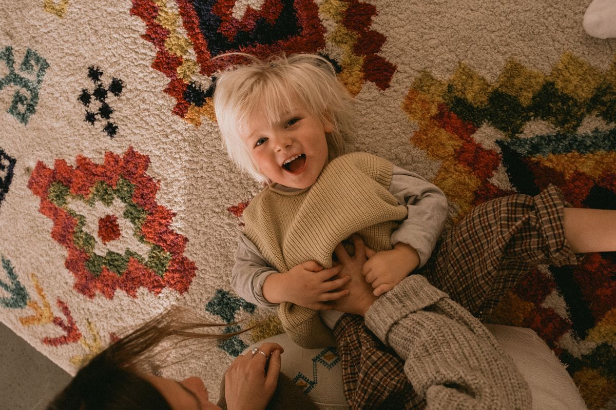 Sample image taken with the Sigma 15mm f/1.4 DC Contemporary of a parent tickling a child