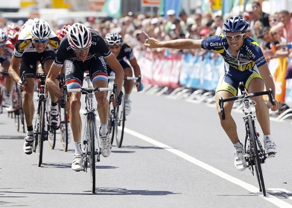 Romain Feillu (Vacansoleil) gets breakaway rider Frank Schleck before the line.
