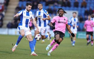 Josh Eppiah of Northampton Town contests the ball with Connor Hall of Colchester United during the Sky Bet League Two between Colchester United and Northampton Town at JobServe Community Stadium on February 25, 2023 in Colchester, England. (Photo by Pete Norton/Getty Images)