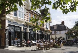 Summer drinkers enjoy a warm Sunday afternoon in Dulwich