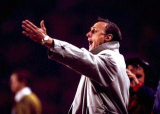 Barcelona coach Johan Cruyff gives instructions during a UEFA Cup game against PSV Eindhoven in March 1996.