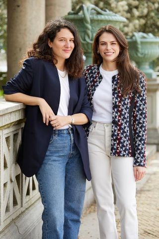 Lauren Sherman and Chantal Fernandez photographed outside on a deck