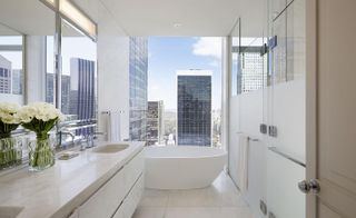 A modern white hotel bathroom