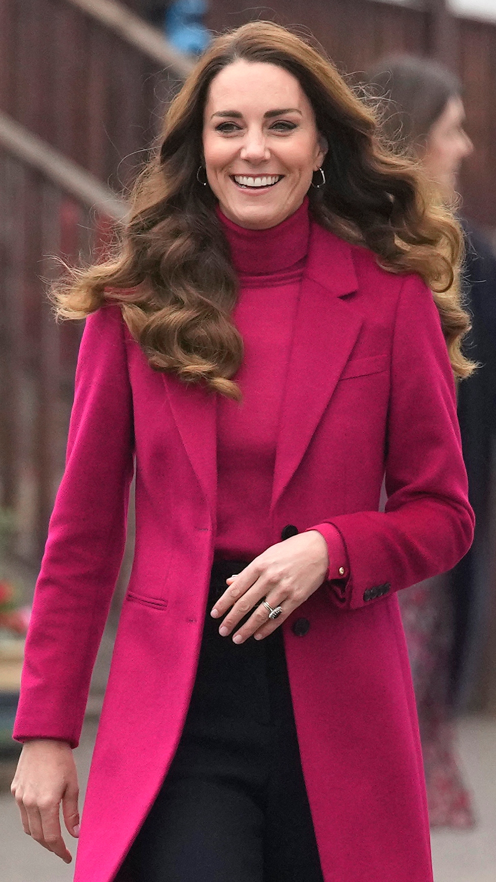 Catherine, Princess of Wales smiles as she arrives for a visit to Nower Hill High School