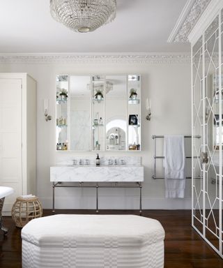 Small bathroom with mirror and chandelier