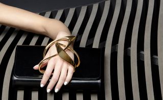 The latter’s signature glove clutch style