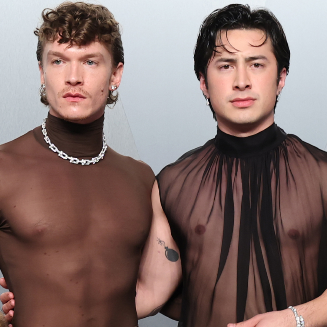 Hudson Williams and Connor Storrie coordinated at the 2026 Vanity Fair Oscar Party in matching naked shirts
