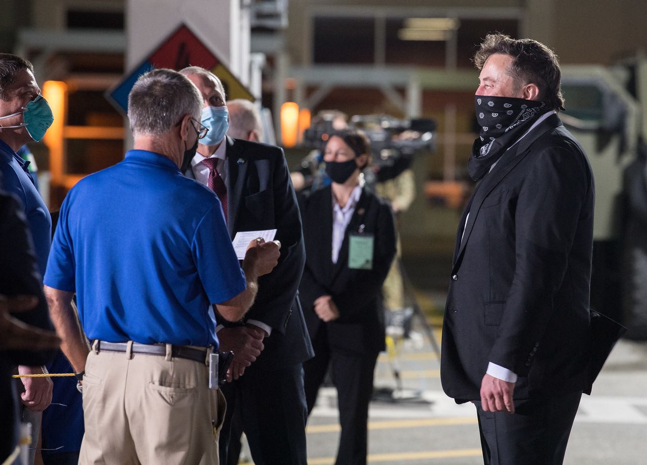 Acting NASA Administrator Steve Jurczyk (back, center) and SpaceX founder and Chief Engineer Elon Musk (right) chat with the Crew-2 astronauts before launch.