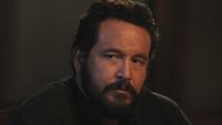 Close-up on Rip looking intently at Beth in Dutton Ranch Season 1